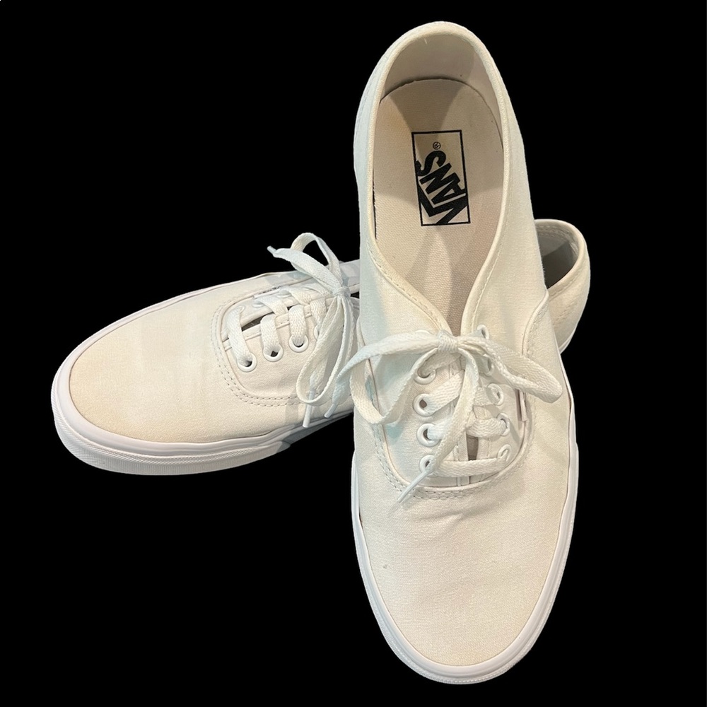 Vans Men’s white sneakers, size 11 tie-ups. Canvas uppers with rubber soles.